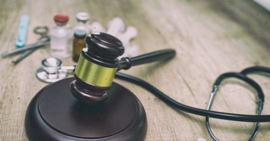 Judge's gavel and medical supplies